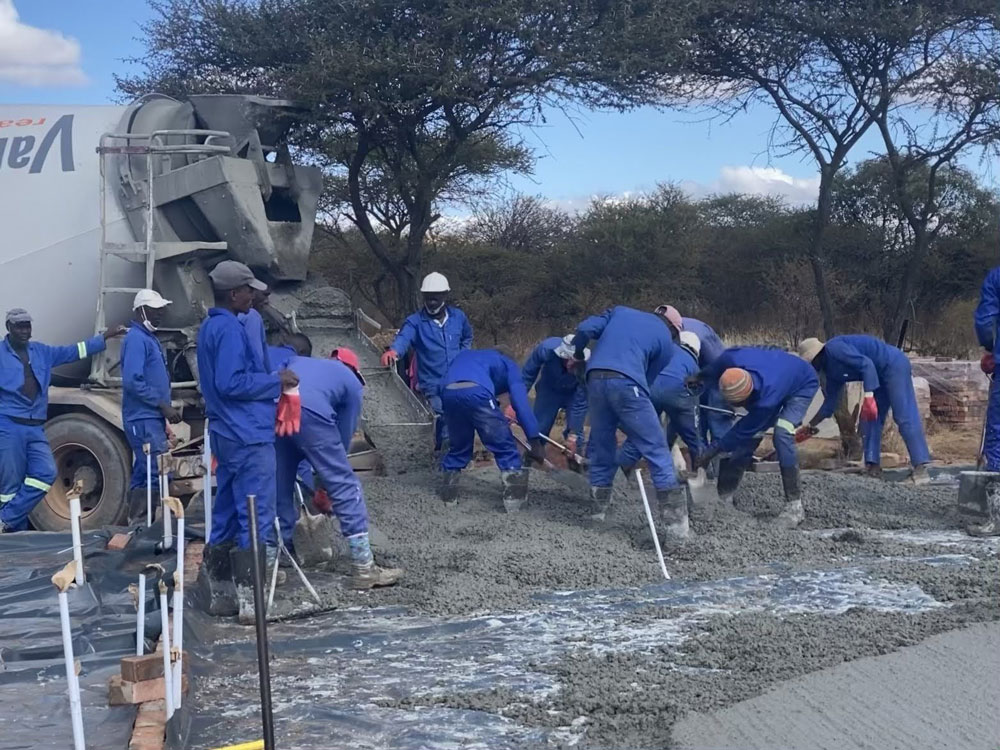 Swift City team pouring a concrete slab